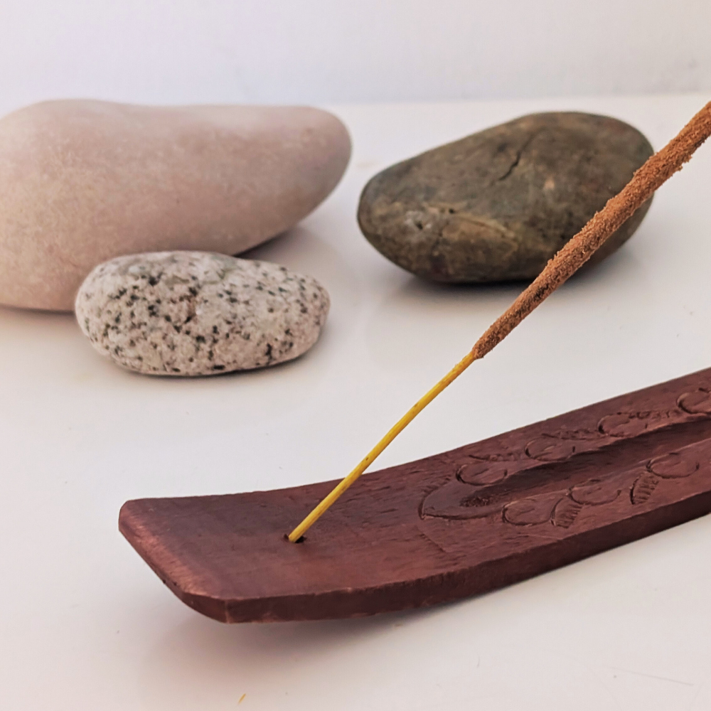 hole to hold incense on a hand-crafted wood incense holder burner