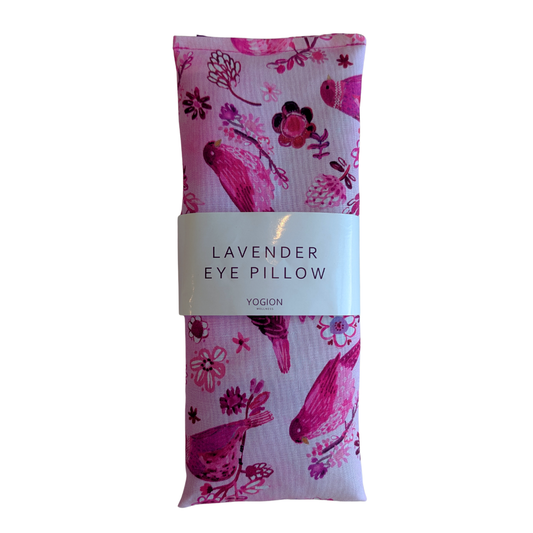 Lavender eye pillow with floral design and 'Yogion' branding on a white background