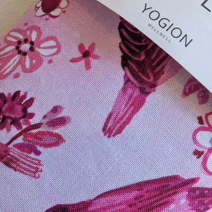 Floral patterned fabric with 'Yogion Wellness' branding.