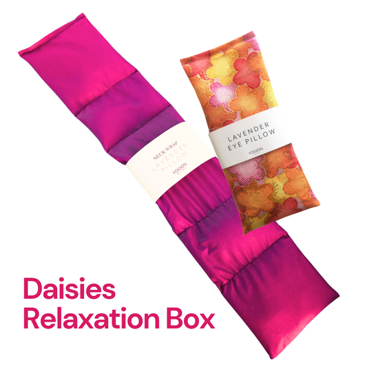 Pink lavender neck wrap and floral lavender eye pillows with 'Daisies Relaxation Box' text on a white background