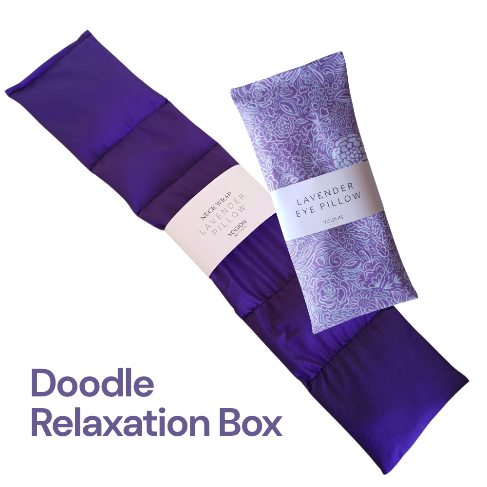 Purple lavender eye pillows with packaging on a white background