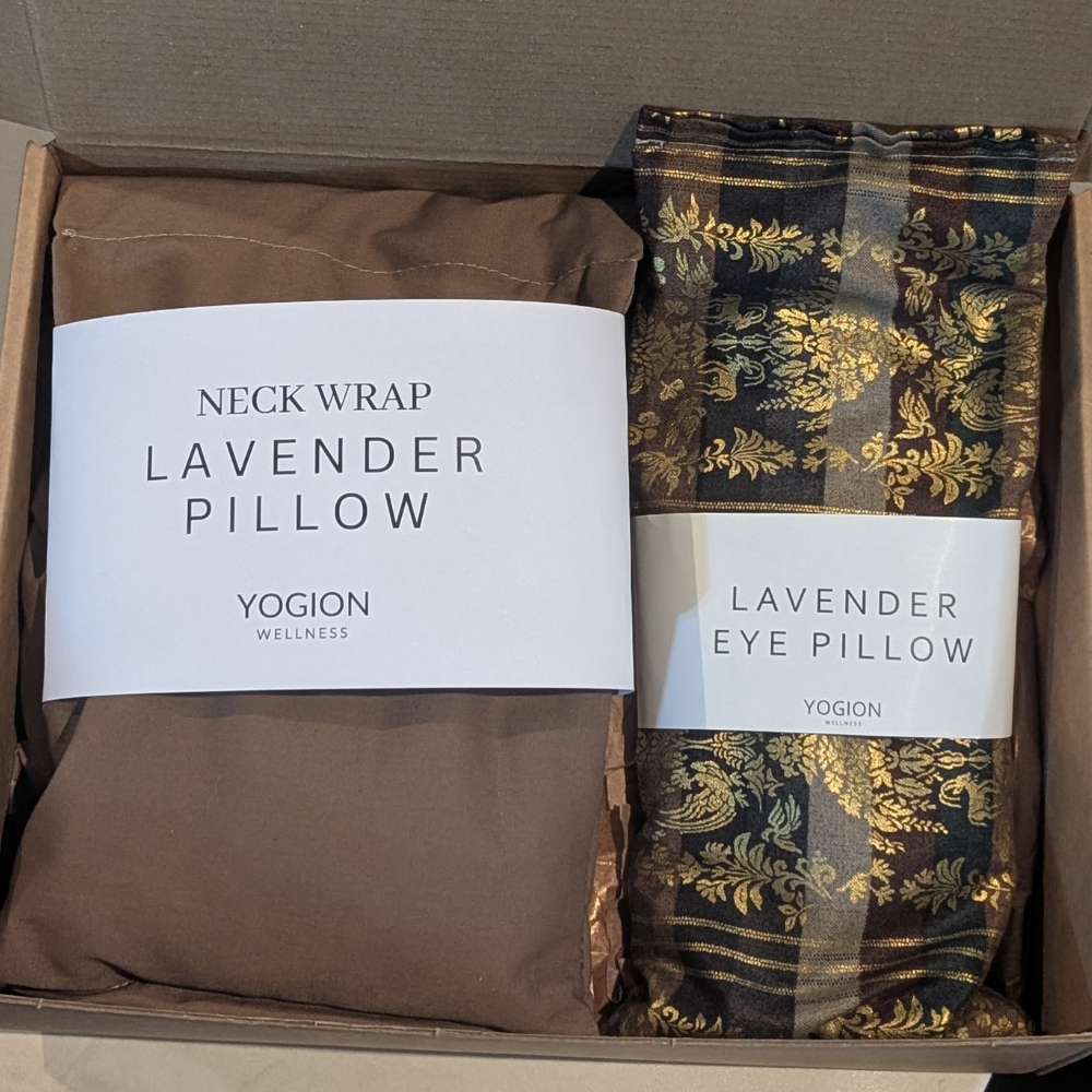 Two lavender products, a beige neck wrap and an eye pillow with gold details, gift set 