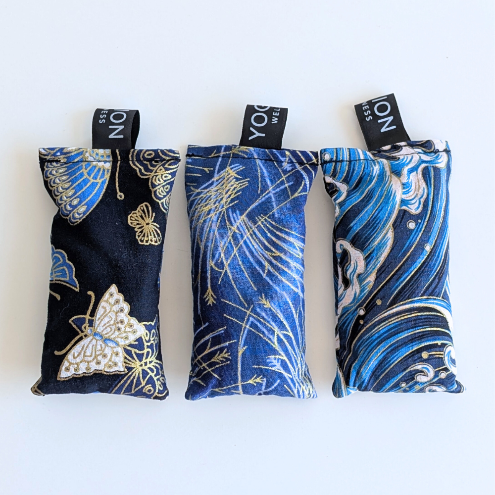 Three blue japanese themed fabric lavender sachet bags on a white background by yogion wellness