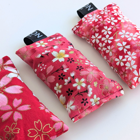 Three pink and gold patterned LAVENDER sachets on a white background by yogion wellness