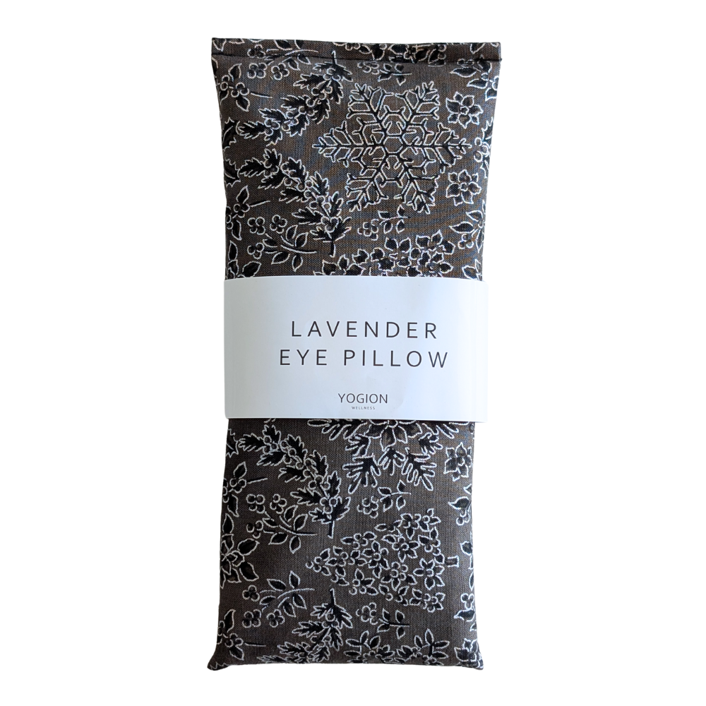 Lavender eye pillow with floral christmas pattern packaging on a white background
