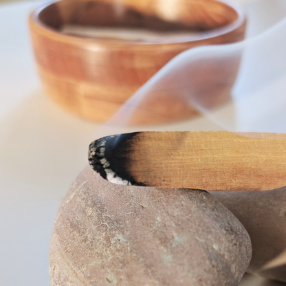 burning palo santo stick