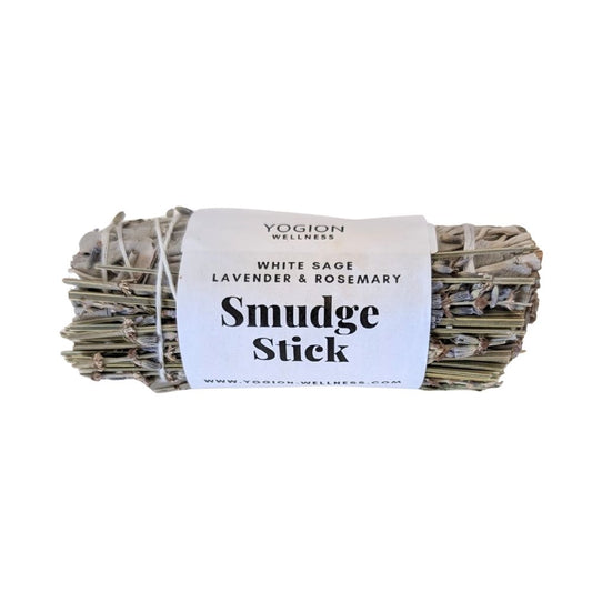 Yogion Wellness smudge stick with white label on a white background, CYPRUS, WHITE SAGE, LAVENDER AND ROSEMARY