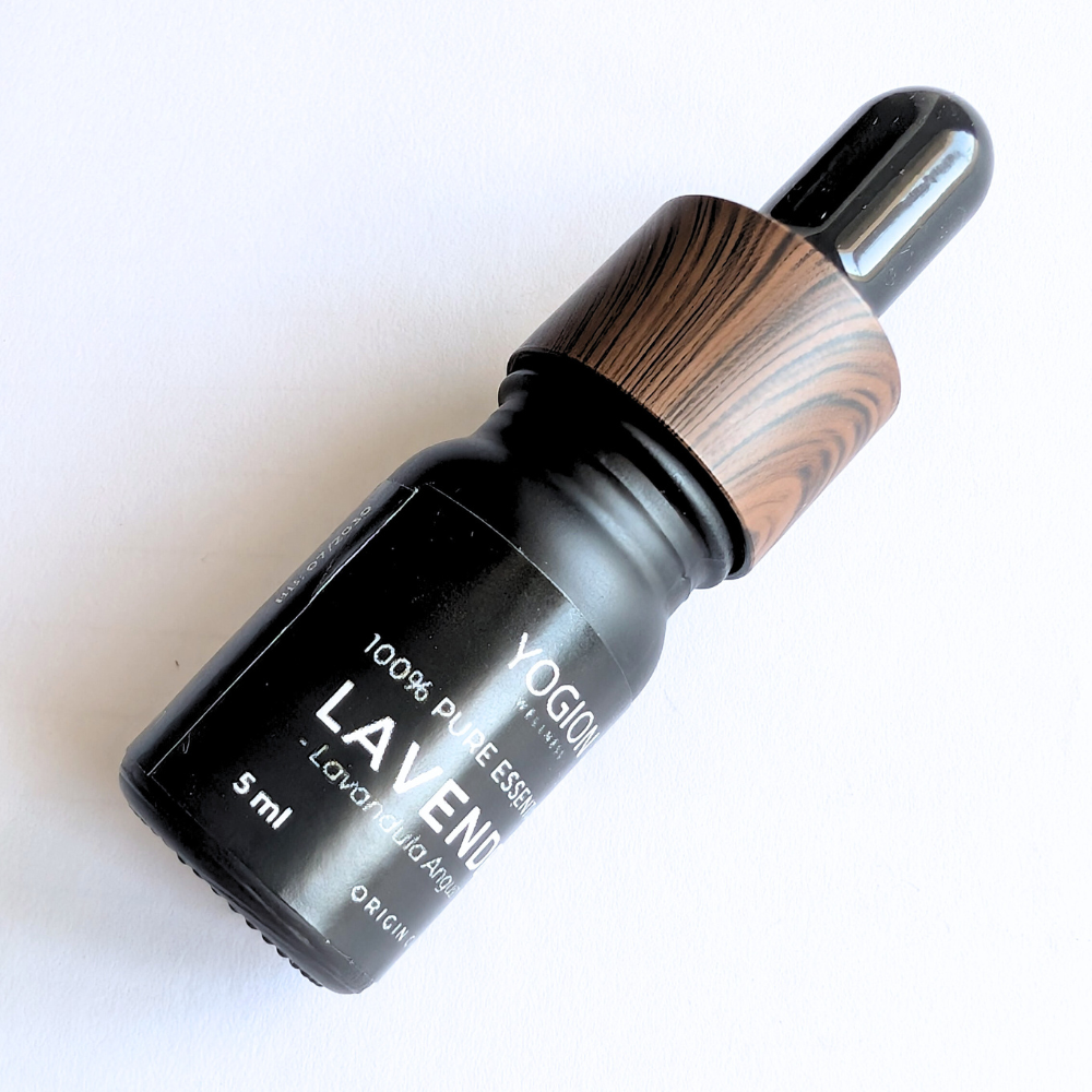 lavender essential oil dropper bottle with wooden cap on a white background by yogion wellness cyprus