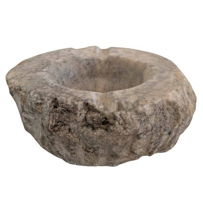 A rustic, hand-carved stone bowl with a rough, organic shape and a central recessed bowl, shown on a plain white background. for smudging and rituals