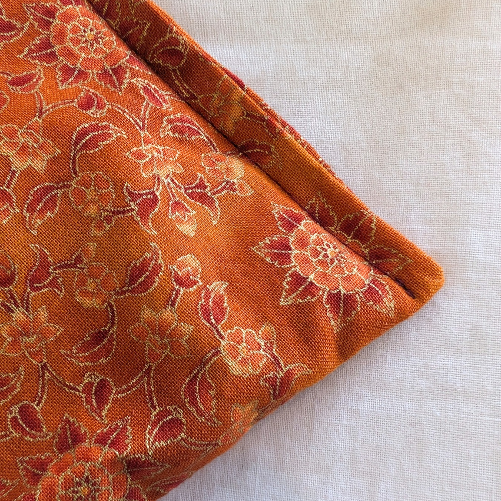 Lavender eye pillow orange botanical with golden detail by Yogion wellness Cyprus  detail