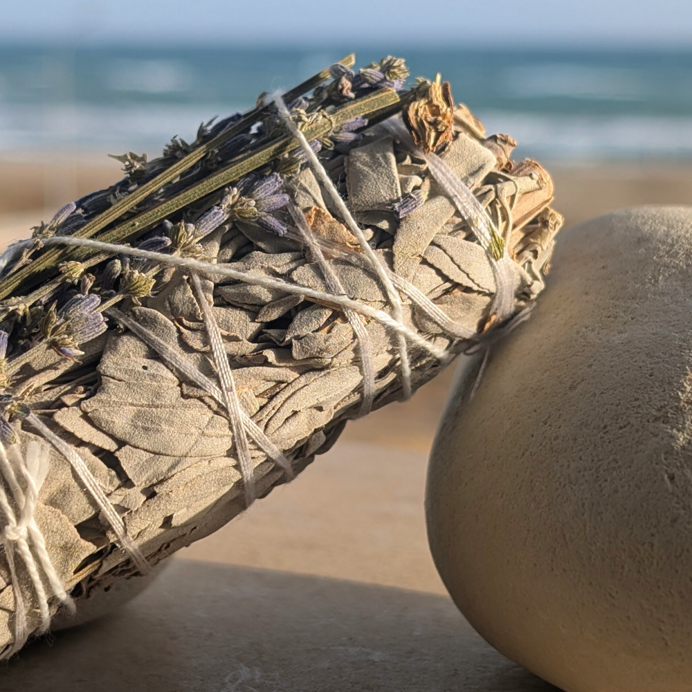 Hand-tied white sage and lavender smudge stick, beach view