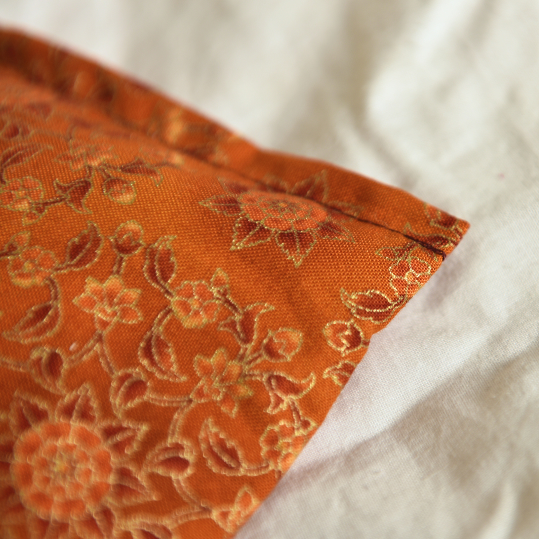 Lavender eye pillow orange gold botanical fabric detail